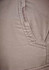 Close-up of a pair of men's cargo pants in a light beige colour, featuring a side pocket. The pants have a textured fabric.