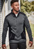 A man wears a grey and black Unisex Streetworx Reinforced Knit 1/2 Zip Pullover, featuring a zippered pocket and side pockets.