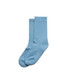 Two pairs of light blue socks arranged neatly, made from soft fabric, with a simple design.