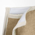 A textured jute cooler bag with a cream lining and stitching, featuring a pocket and insulating material.