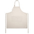 A linen apron in cream with a front pocket, featuring adjustable straps and ties at the sides.