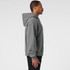 A grey jumper with a hood, displayed from the side. Features a logo on the garment.