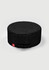 A round, black chef cap with a gathered elastic section and a small branded label.