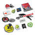 A collection of colourful lapel badges in various shapes, including animal, logo, and event-themed designs, with pins.