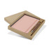 A pink notebook and silver pen set displayed in a brown gift box. The packaging is sleek and minimalistic.