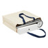 A cream heavy-duty canvas tote with navy handles, filled with various items including books and a box.