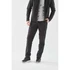 Men's Soho Performance Pant in black, featuring a sleek design and a logo, styled with a grey top and black shoes.