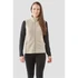 A woman is wearing a beige full zip fleece vest over a black long-sleeve top, featuring side pockets.