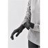 A pair of knit gloves in charcoal grey, displayed on a hand against a neutral background. The gloves have a logo.