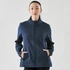 A navy softshell jacket with a front zip and side pockets, worn by a woman. The jacket features a logo.