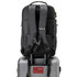 A black Swissdigital Java Backpack rests on a silver suitcase, featuring padded straps and a logo.