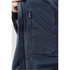A close-up of a navy lightweight rain jacket featuring a zipped pocket and mesh detailing. It includes a logo.
