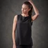A woman wearing a black tank top with a sleek design, featuring an unobtrusive logo.