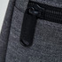A drink bottle cooler in grey fabric, featuring a zippered compartment and a pull tab with branding.