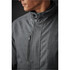 A close-up of a grey men's Montauk System Jacket featuring a zippered pocket and a high collar. The jacket has a logo.