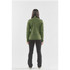A green performance jacket viewed from the back, paired with black pants. The jacket features a logo.