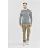 Men's long-sleeve t-shirt in light grey, paired with beige cargo pants and white shoes. Features a logo.