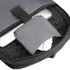 A close-up of a black backpack interior, featuring a laptop and a grey pouch with a circuit pattern.