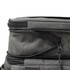 A grey expanding cooler with zippers and compartments for storage. Features a sleek, modern design.