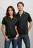 A black polo shirt with green accents, featuring a collar and short sleeves, modelled by two people.