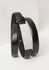 A black leather belt with a silver-tone metal embellishment, featuring a sleek and minimalist design.