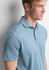 A men's short sleeve polo in a light blue colour with a collar and a logo on the chest.