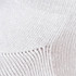 A close-up of a textured white fabric, featuring a knit pattern with visible stitch details.