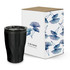 A black coffee cup next to a patterned box featuring blue floral designs and branding.