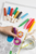 kh380lejp51e73ithlc47kr30d-12834_Artline_300_Markers_Liquid_Crayon_12pc_Lifestyle_1.png