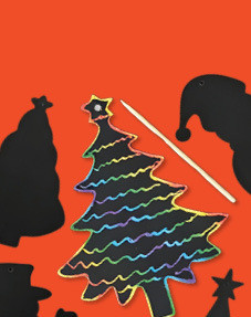 Scratch art Christmas tree revealing rainbow lines, with a wooden stylus and Santa hat shapes