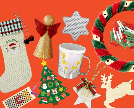 Handmade gifts including a cross-stitch stocking, a decorated mug, a pipe-cleaner wreath and wooden reindeer ornaments