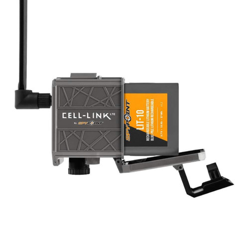 Angled view of a trail camera housing showing a lithium battery pack being inserted into the internal compartment