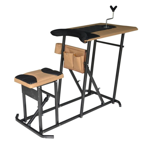 Angled view of an integrated metal shooting bench with an attached tan seat and table surface on a white background