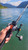 An Okuma Coldwater A CW-45DA linecounter reel spooled with wire line and mounted to a heavy trolling rod.