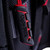 Macro close-up shot of the heavy-duty molded rubber carry handle on top of the Ugly Stik tackle backpack with reinforced red stitching.