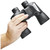 Close-up of a hand firmly gripping the textured rubber body of the Bushnell 10x50 binoculars to demonstrate its size and scale.