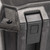 Extreme close-up view of the black secure push button latch mechanism on a Pelican Vault case.