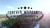 A promotional graphic overlay reading FOREVER WARRANTY NO QUESTIONS ASKED framed by five stars at the top and a laurel wreath at the bottom. The text is superimposed over an aerial perspective view of a scenic forest mountain valley under a bright sky.