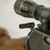 Close-up lifestyle view of GrovTec GTHM308 hammer extension mounted on a lever-action rifle hammer below a riflescope