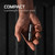 Lifestyle view of a human hand holding the compact keychain flashlight to demonstrate its pocket sized scale