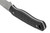 Close-up view of the textured black handle on the Schrade Exertion fixed blade knife showing the lanyard hole