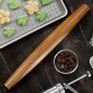 French tapered walnut rolling pin on kitchen counter beside spritz cookies and baking tools; no-handle tapered design French tapered walnut rolling pin on kitchen counter beside spritz cookies and baking tools; no-handle tapered design
