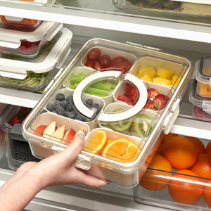 OTG Snackle Box in fridge, filled with fruit and veggies; clear divided container with snap-lock lid