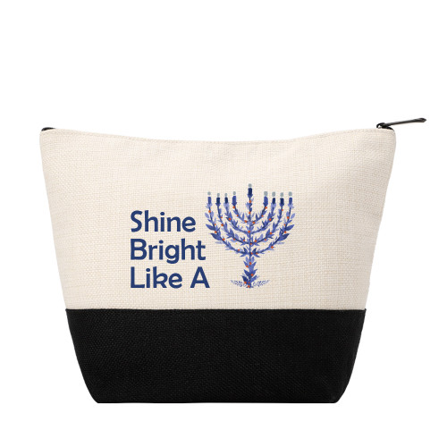 Shine Bright color-block zip pouch with blue menorah graphic, natural/black panels, and zip-top closure