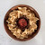 A top-down view of the acacia chip and dip platter filled with chips and salsa, showcasing it as the perfect centerpiece for serving appetizers.