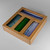 An angled shot of the empty bamboo bag organizer, highlighting its sturdy construction and the four separate compartments designed for different bag sizes.