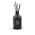 A clear, isolated product shot of the Fresh Linen reed diffuser against a plain white background, highlighting the sleek dark gray bottle, black label, and tall black reeds.