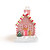 Gingerbread house incense burner on white background with smoke rising from the chimney
