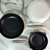 Two empty cast iron fry pans, one larger than the other, both with nonstick ceramic interiors and stainless steel handles, placed on a white surface.