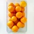 Clear rectangular organizer bin filled with oranges on a white counter, curved front pull